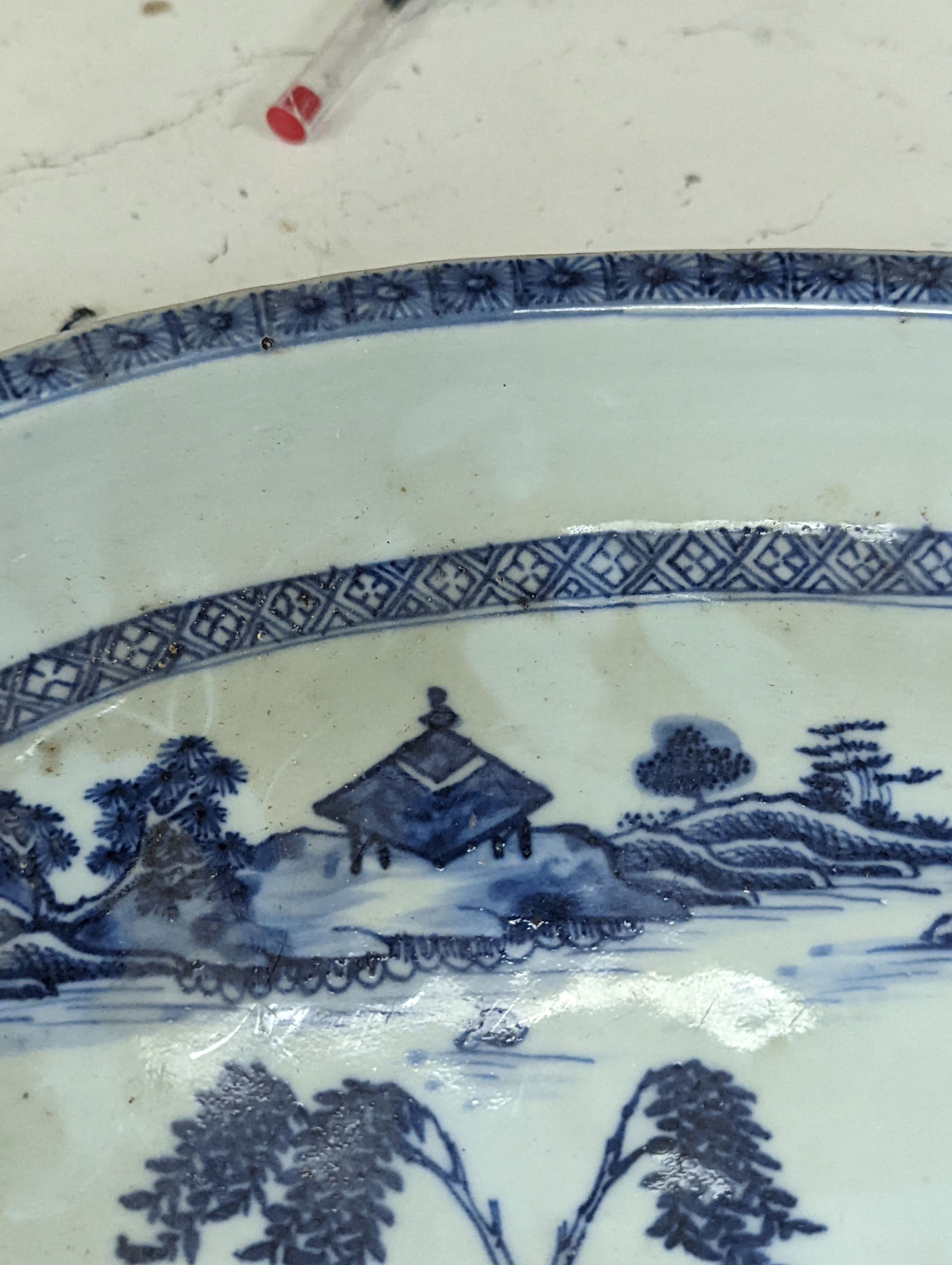 An 18th century Chinese export oval blue and white dish, 32cm.
